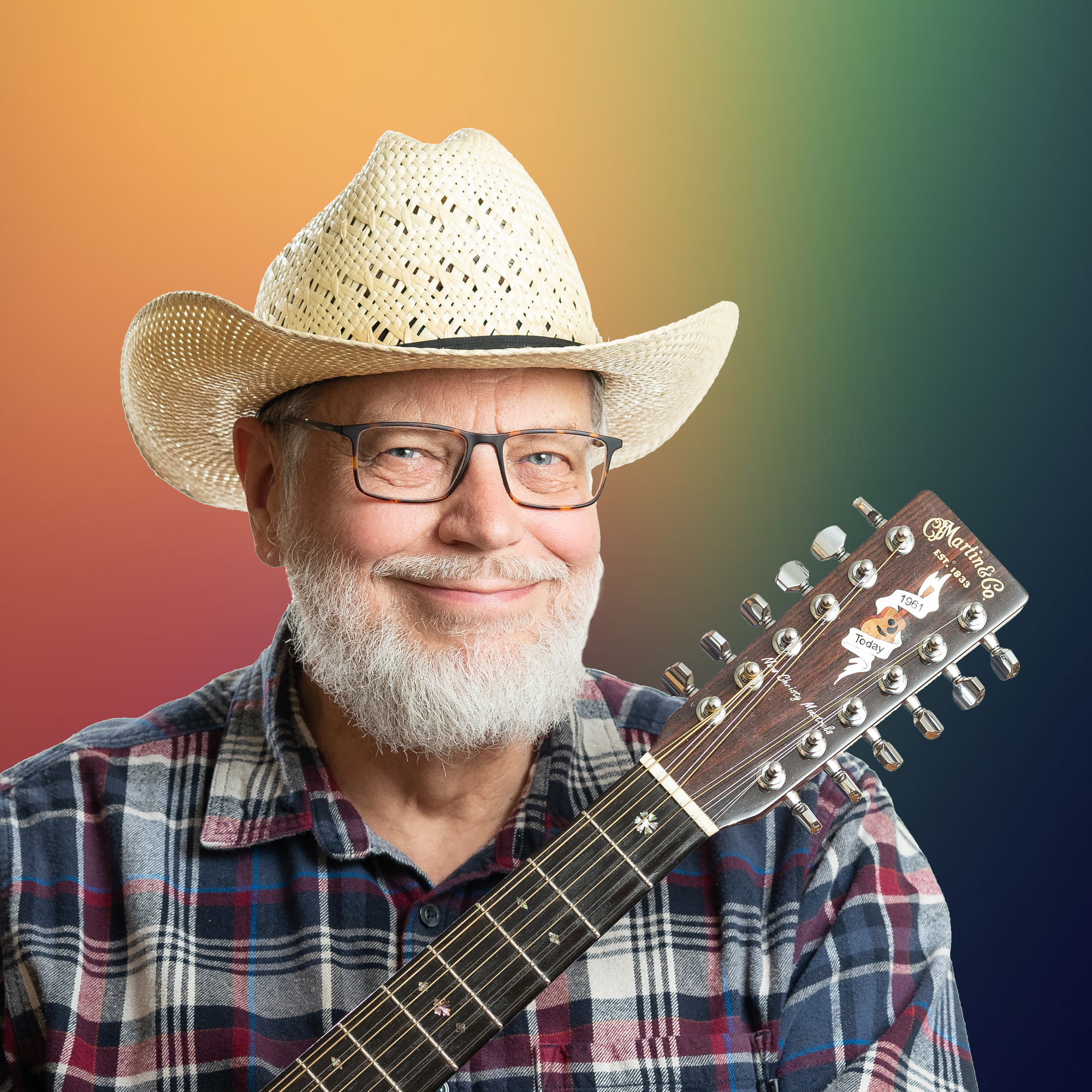 a professional guitarist posing for a traditional headshot