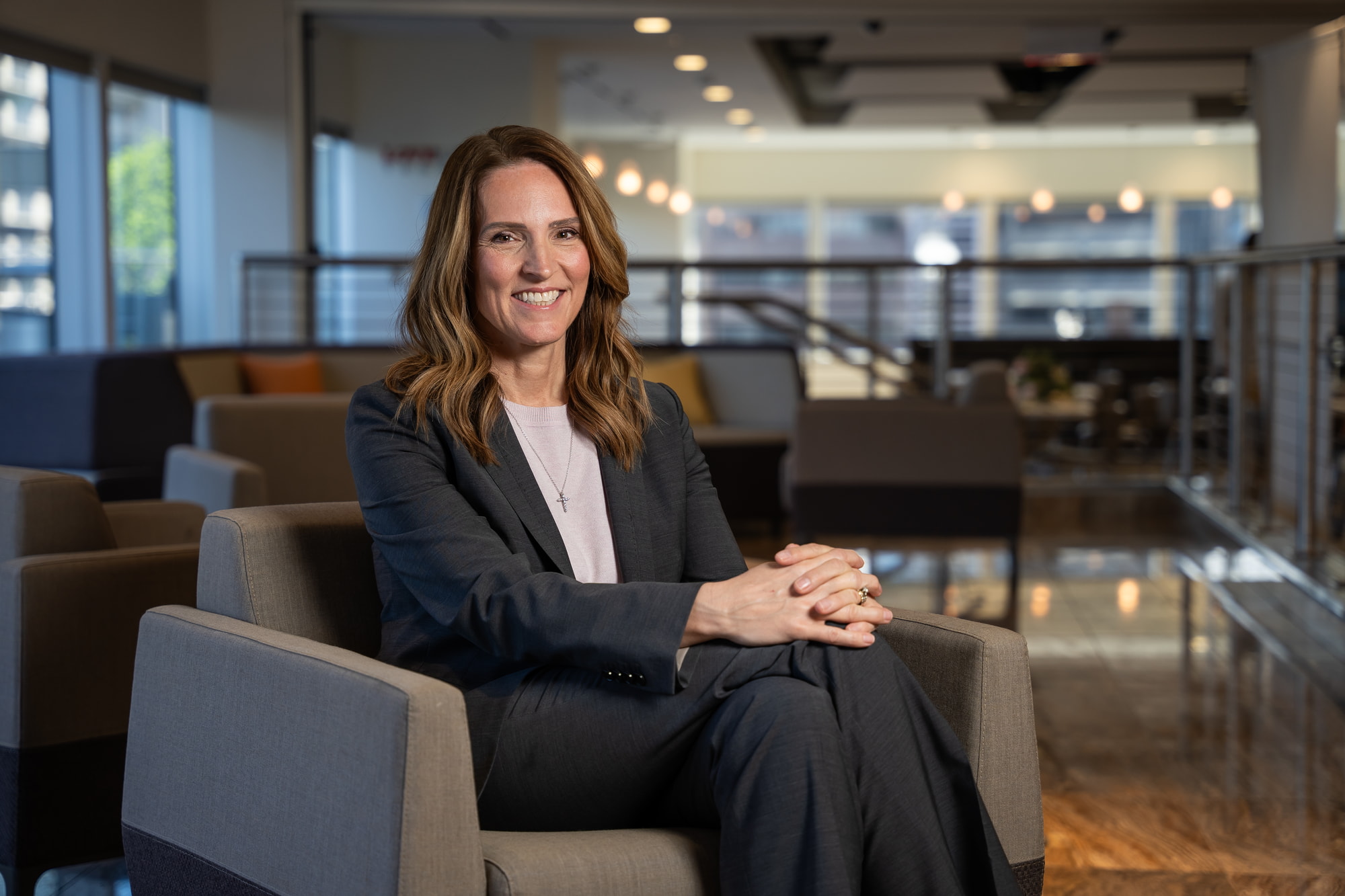 An executive sitting for a headshot branding session